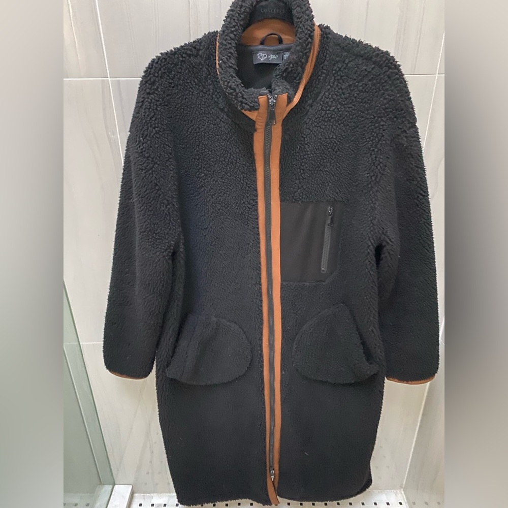 Black long Teddy bear coat with zip and brown trim